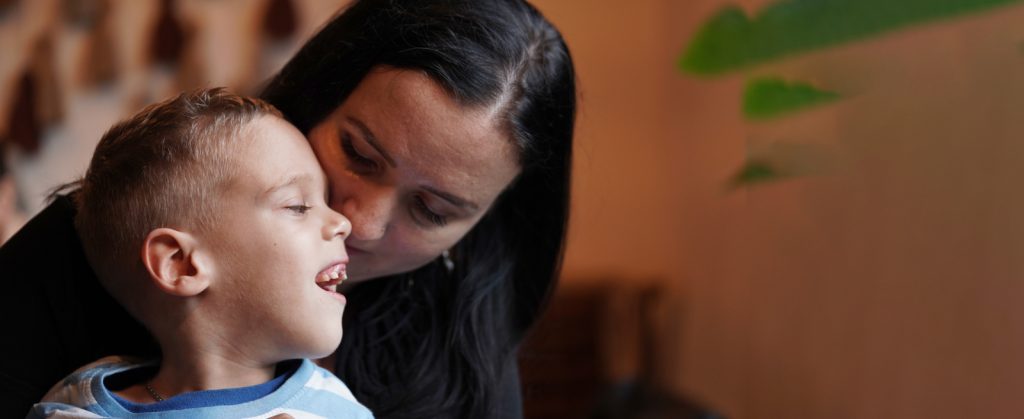 Developmental Disabilities: Mother and son with DD interacting at home