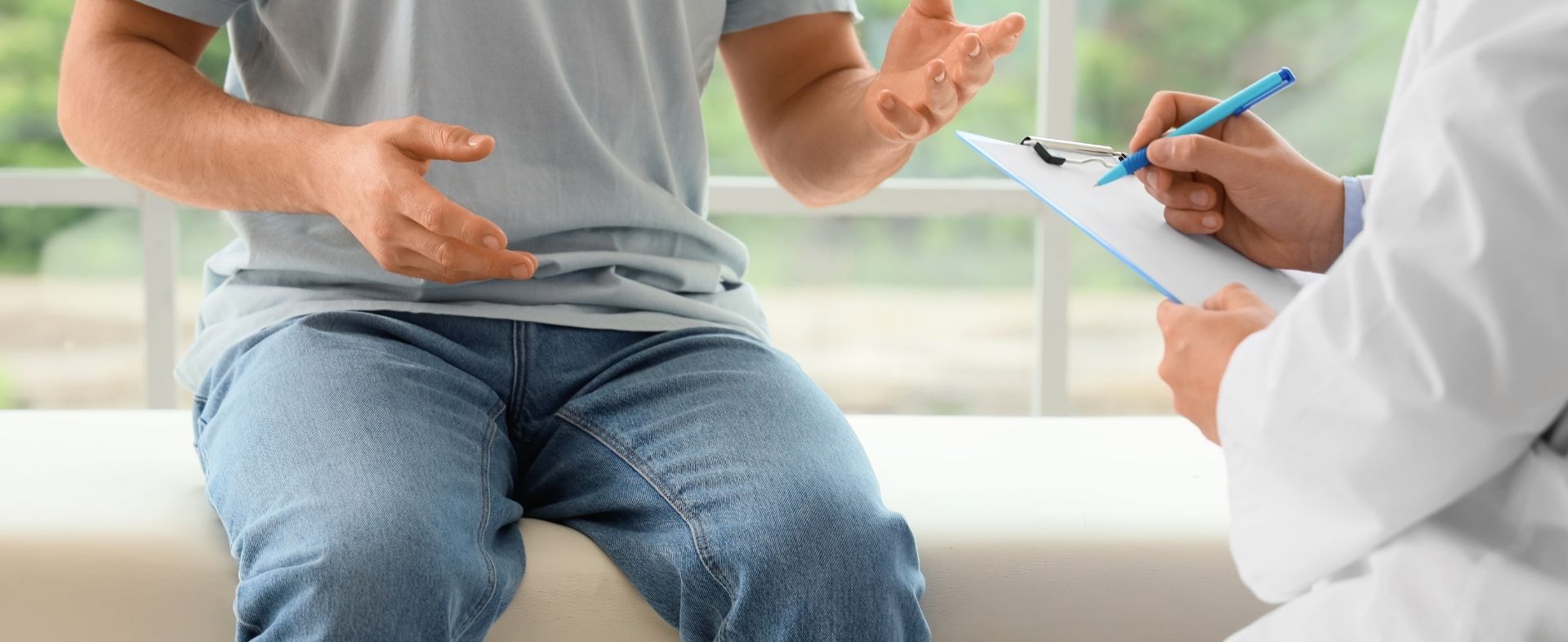 Patient speaking with a doctor about health concerns in a clinical setting